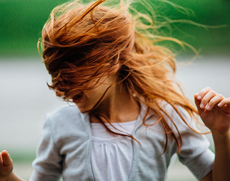 Woman shaking her head while dancing