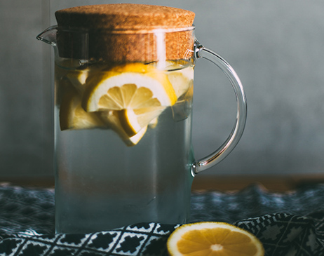 Water in a jug with lemons