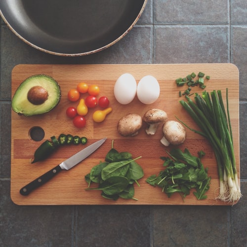 Chopping board with nutritious ingredients on top